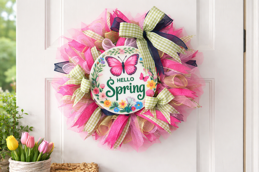Spring wreath with pink tulle, butterfly, and 'Hello Spring' text on a white door.